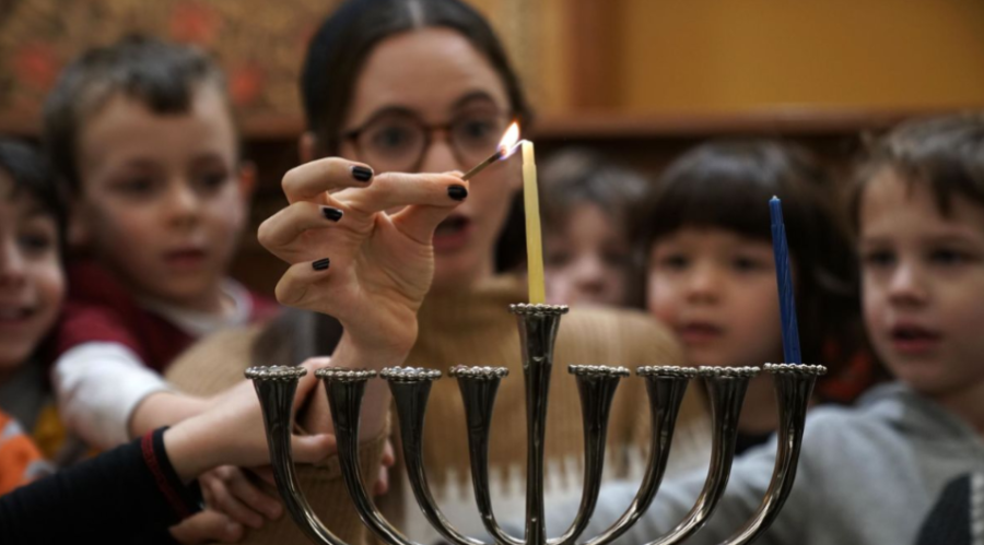 Preschoolers learn how to light a menorah for Hanukkah on, Nov. 30, 2018 at Adas Israel Congregation. 
Photo Credit: Alex Wong/Getty Images