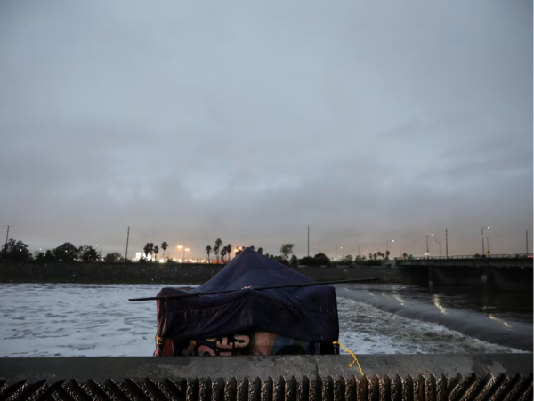 Tents belonging to homeless people in the midst of the hurricane on Aug. 22, along the Los Angeles River in Long Beach, California. (Zaydee Sanchez/Reuters)