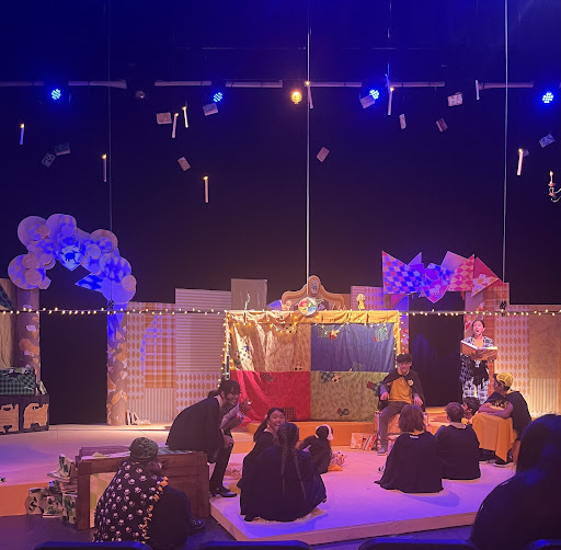 During dress rehearsals on Oct. 24, the cast and crew run through the show at the auditorium. This scene is set in the Puffs’ common room, while a character tells a story. 
