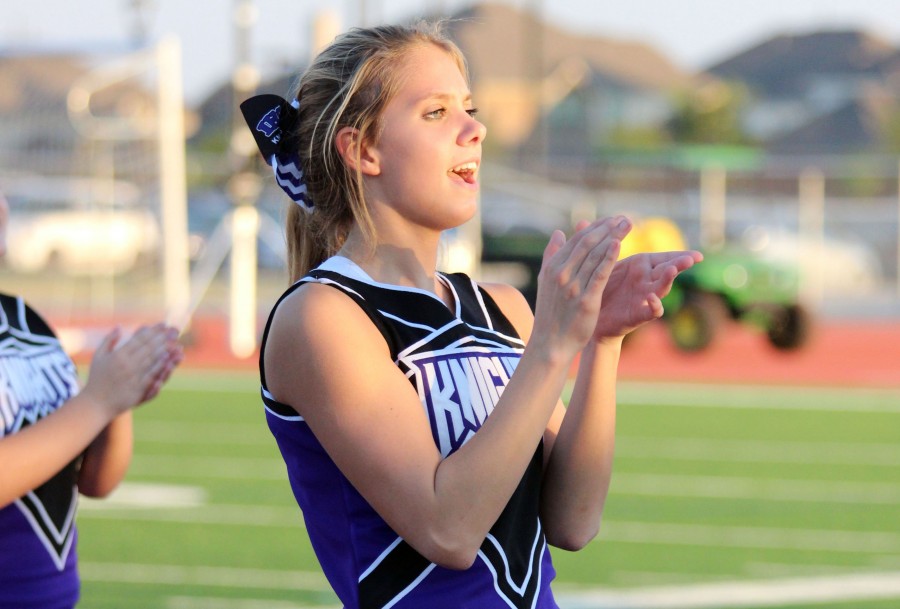 Peyton Harris shows her school spirit as co-captain of the cheerleading squad. 