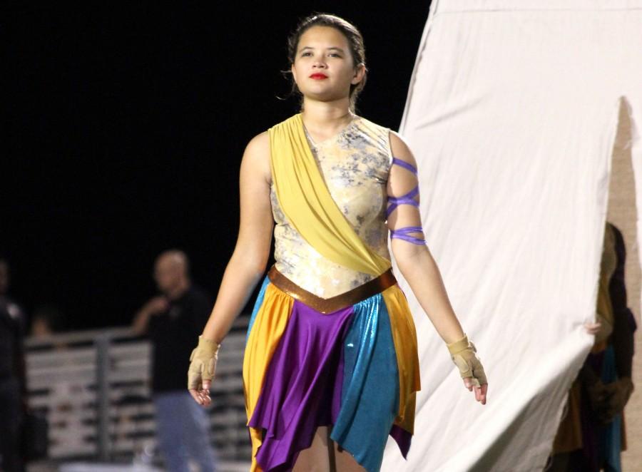 As the season changes, Natasha Nagase and her teammates switch from color guard to winter guard.  