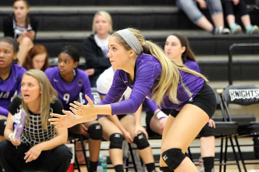 Carter Kennedy prepares for a hit as a part of the varsity volleyball team. 