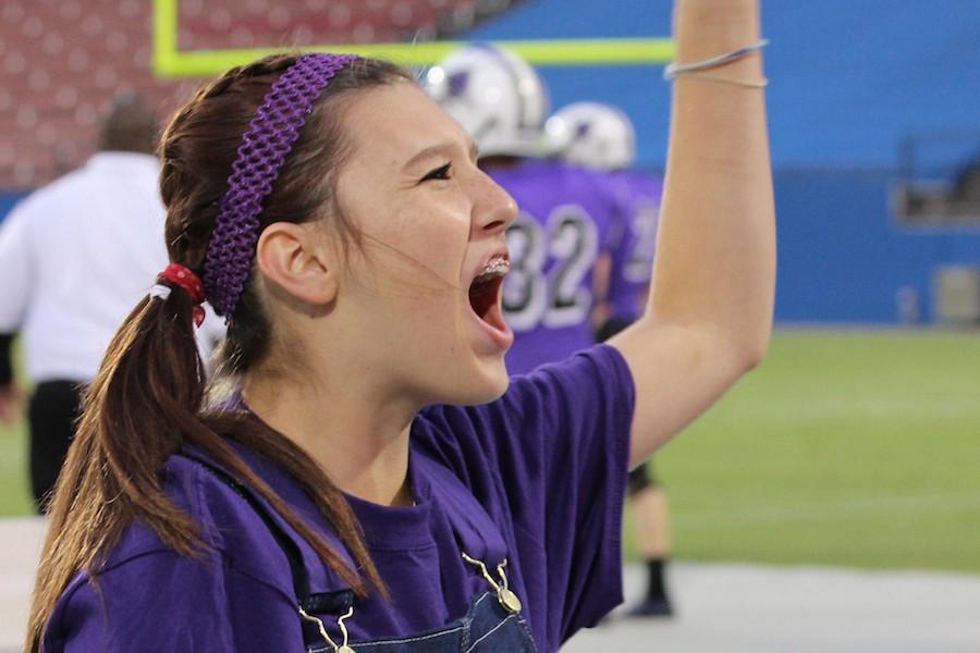 Sophomore Taylor Lenard yells at a home football game. 