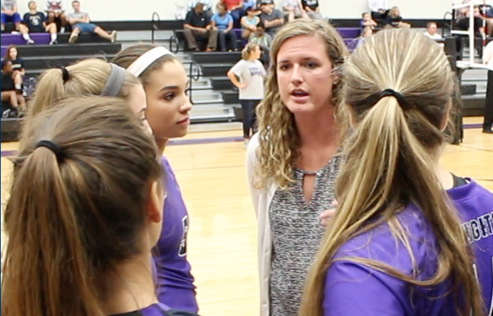 Coach Phillips giving a pep talk to Jordyn Carswell and the rest of the varsity team. 