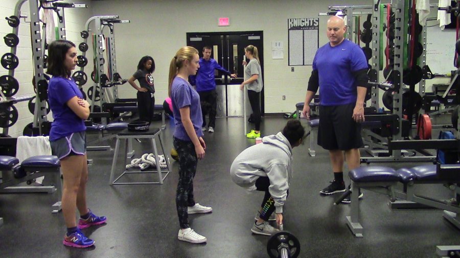 Coach Walker checks if the female powerlifters are using proper lifting techniques. He does this to make sure they’ll be ready for any co-ed competitions, meets or even practices. 