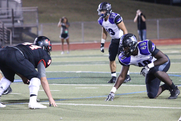 Jalen Freeman (40 Right) who will be a captain on the football team next year has gained leadership skills without the presence of his father. 