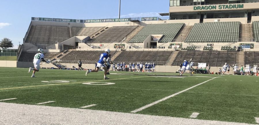 Senior Arturo Lopez charges for possession of the ball in the fourth quarter of the lacrosse game against Southlake as the Frisco Bears fight for another win.