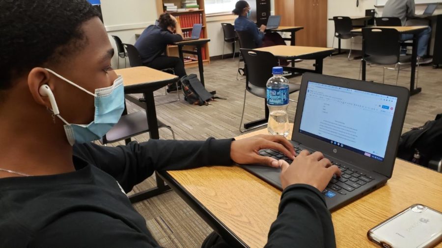 Savion Gordon, working on his essay for English IV, in Mr. Lillie’s class. From March 1-March 15, senior Knights in English IV had to write an essay and multimedia presentation, around a current turbulent issue such as obesity, beauty standards, and others. (Jackson Cole/Knight Press).
