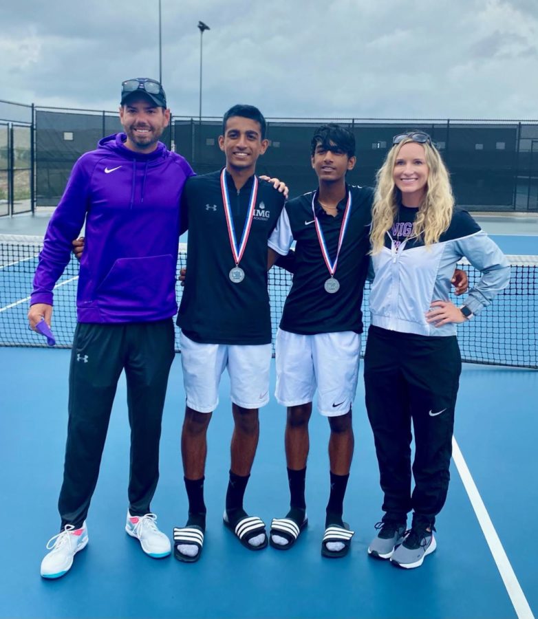 Coaches Jennifer Paine and Daniel Olivares stand alongside the boys doubles state qualifiers. 