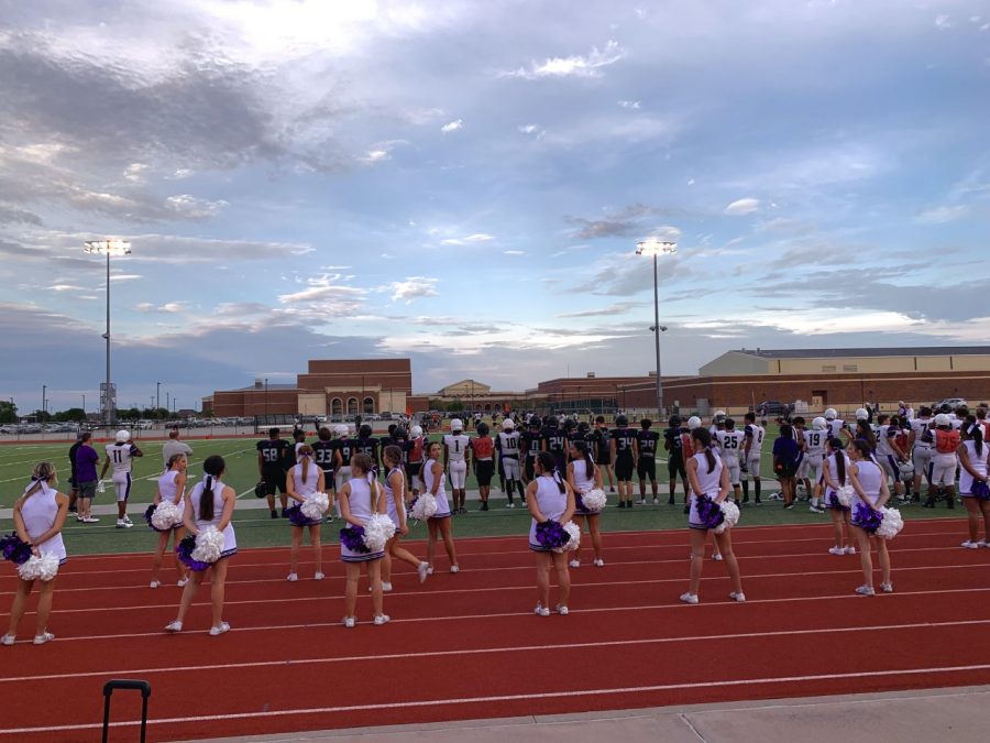 IHS cheerleaders stand-by ready to cheer on the varsity football scrimmage game on Saturday, August 16 at the annual Rumble celebration.