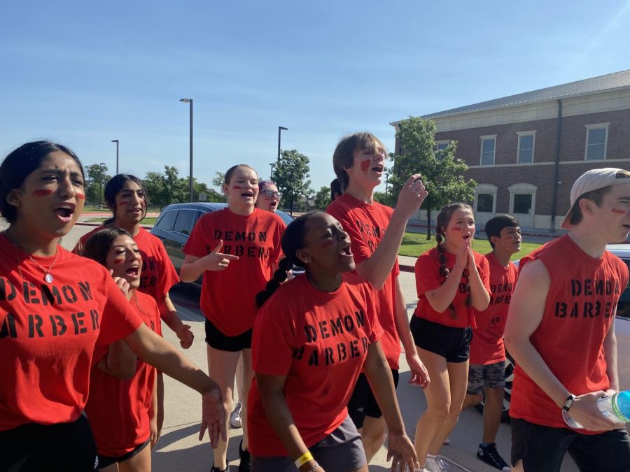 The winning team of the Knight Theater Games, Demon Barber, shouts their victory chant on the road, during the morning of the event.