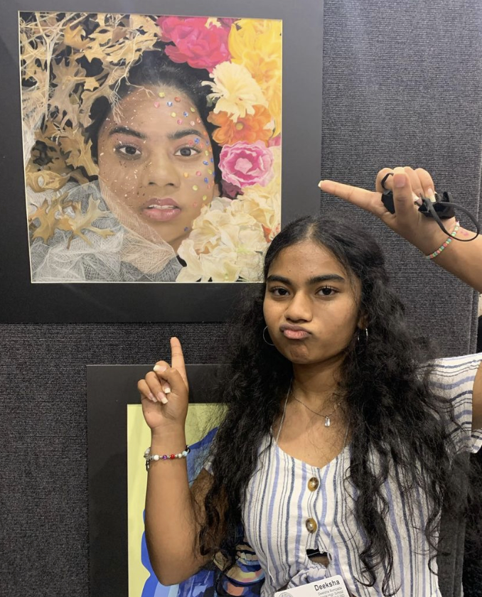 Deeksha Bompada poses with her art piece, “Cyclic”, at a state competition on May 1st, 2022. 
