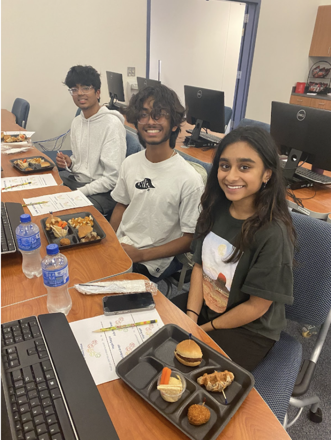 Abijith Vijayan, Siddhartha Yerra, and Nidhi Kayshap, juniors at IHS, try the new school lunch menu on Sept 26, 2022, at the Service Center. 