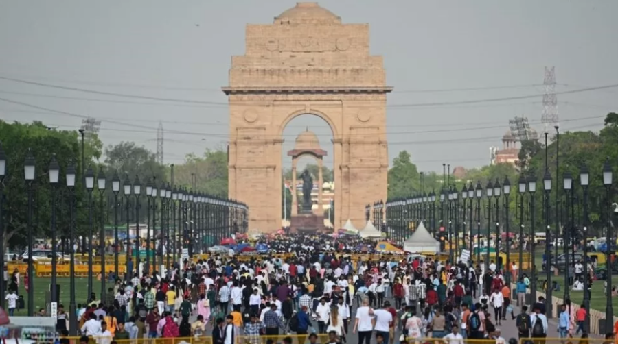 Indians are photographed at India Gate in New Delhi, India. (BBC News/ George Wright)
